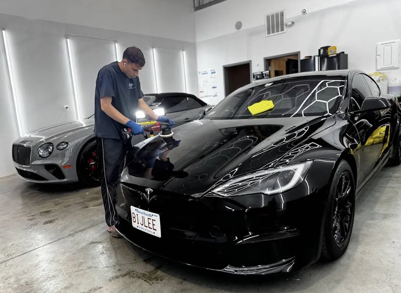 Black Tesla Model S paint correction before protection at Secret Touch Auto Spa Shrewsbury MA