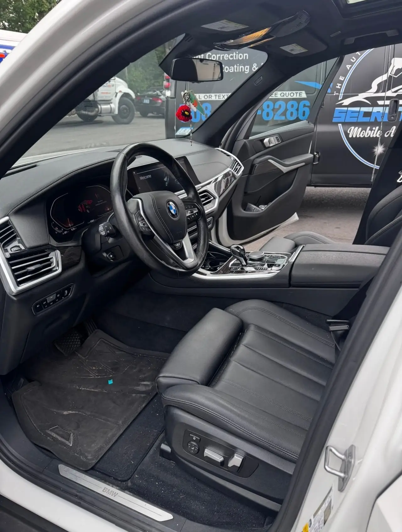 Before - BMW X5 white interior driver seat before and after detailing Shrewsbury MA