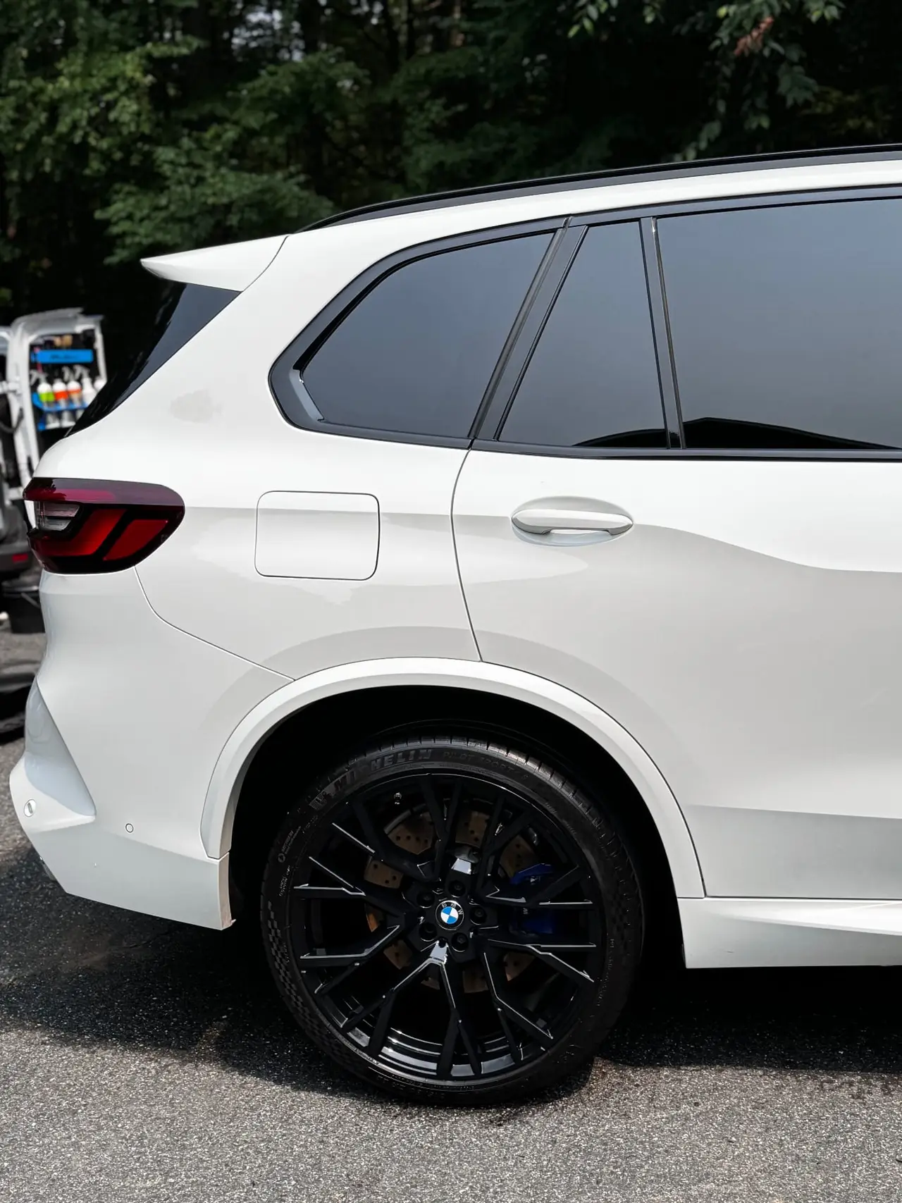 BMW X5M rear gloss black powder coated wheel closeup