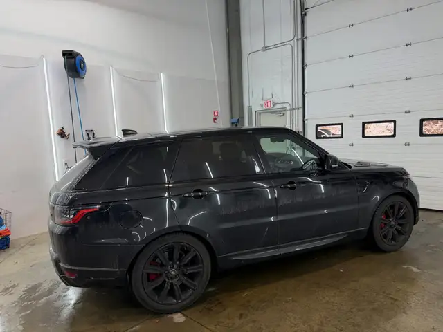 Before - Range Rover Sport SVR black exterior side before and after detailing Shrewsbury MA